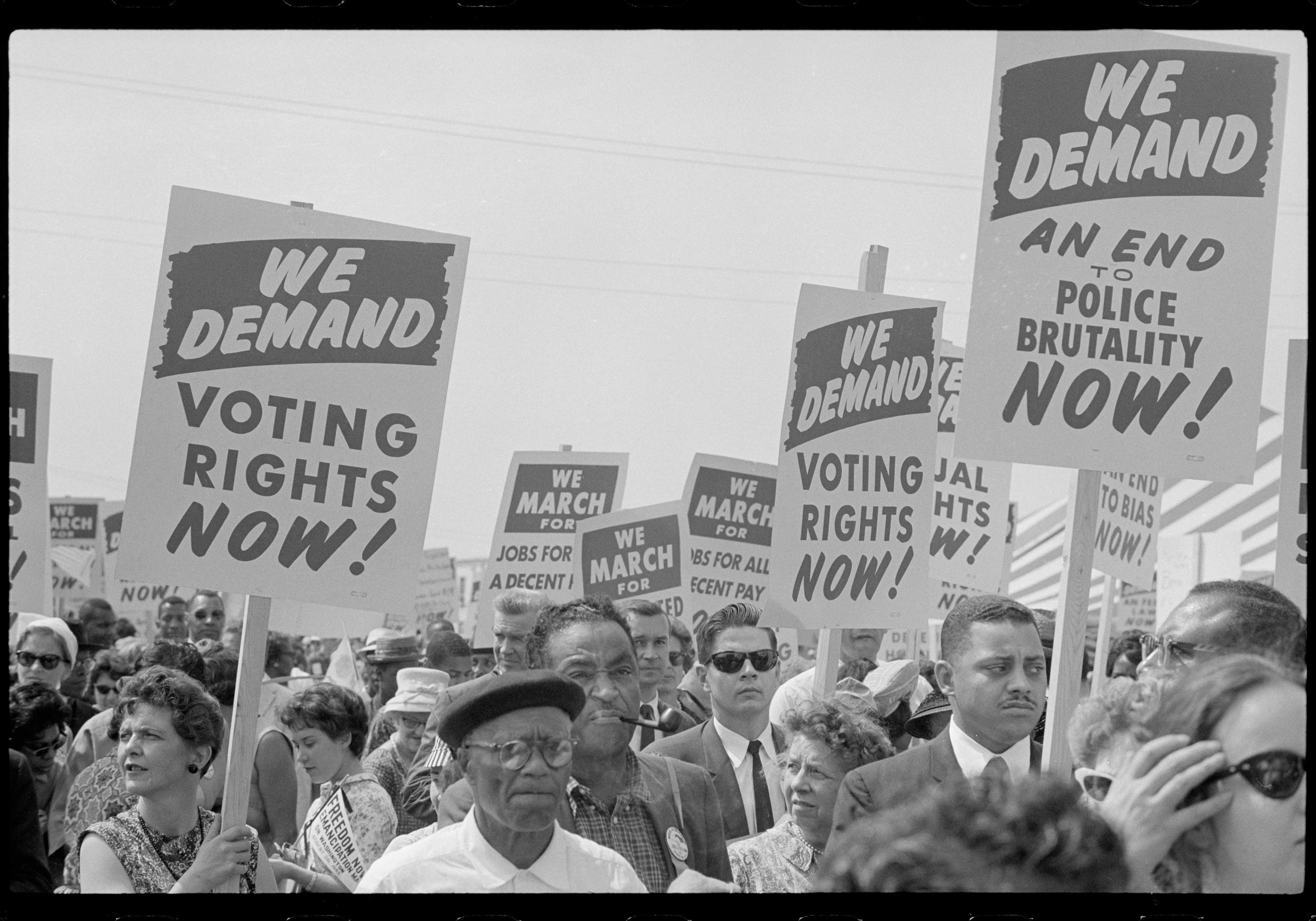 Marchers with signs from the 1963 march on Washington DC